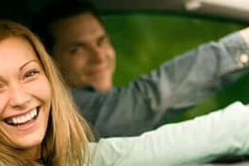 happy couple driving together