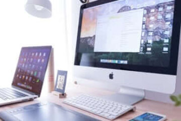 computer and laptop in the table