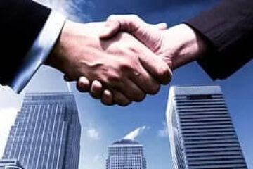 two men handshaking after a truck loan deal