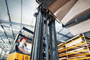 man driving forklift